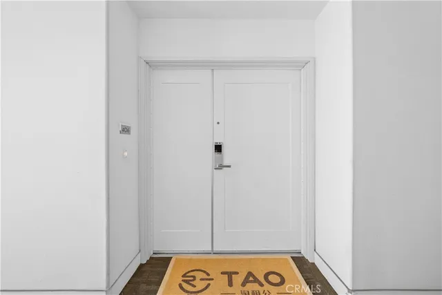 a kitchen with white cabinets and appliances