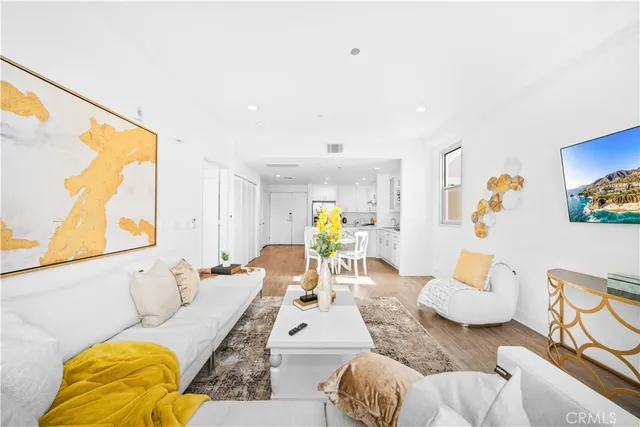 a kitchen with a white counter top space and stainless steel appliances