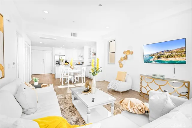 a bed room with a bed and a potted plant