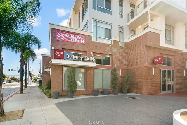 a view of a building with palm tree