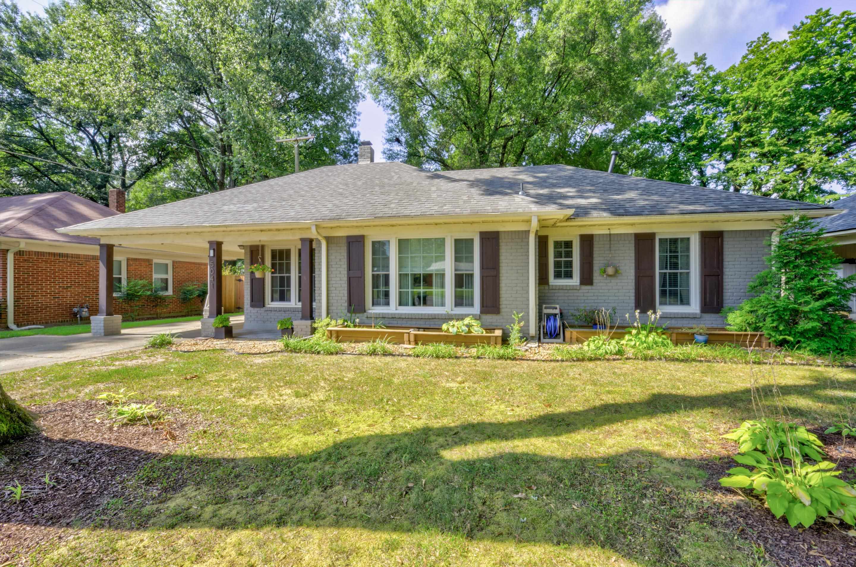 5041 Quince Road Memphis, TN 38117 - Photo 1 of 28 a view of a house with a backyard patio and swimming pool