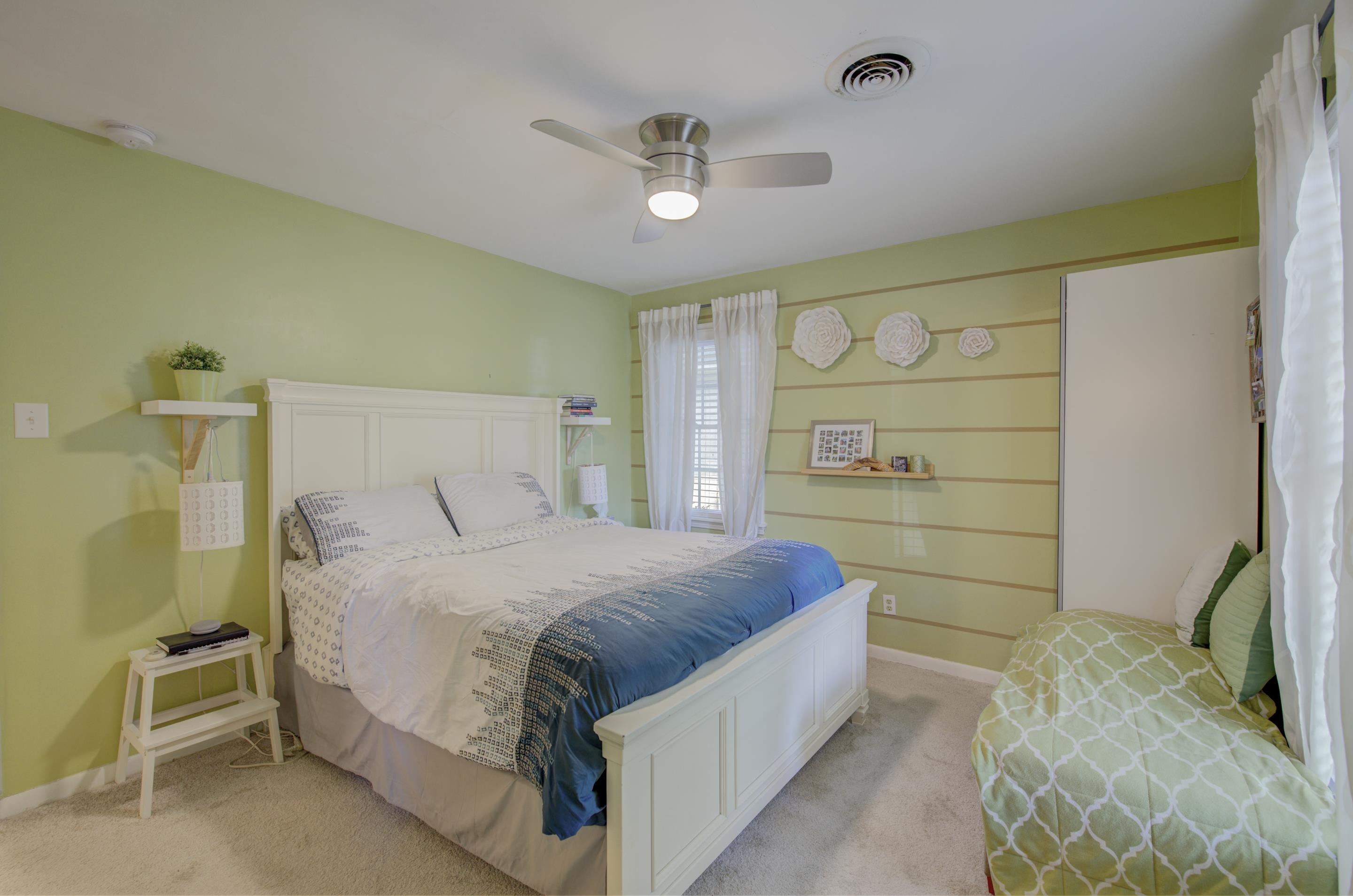 5041 Quince Road Memphis, TN 38117 - Photo 14 of 28 a bedroom with a bed and a cabinets