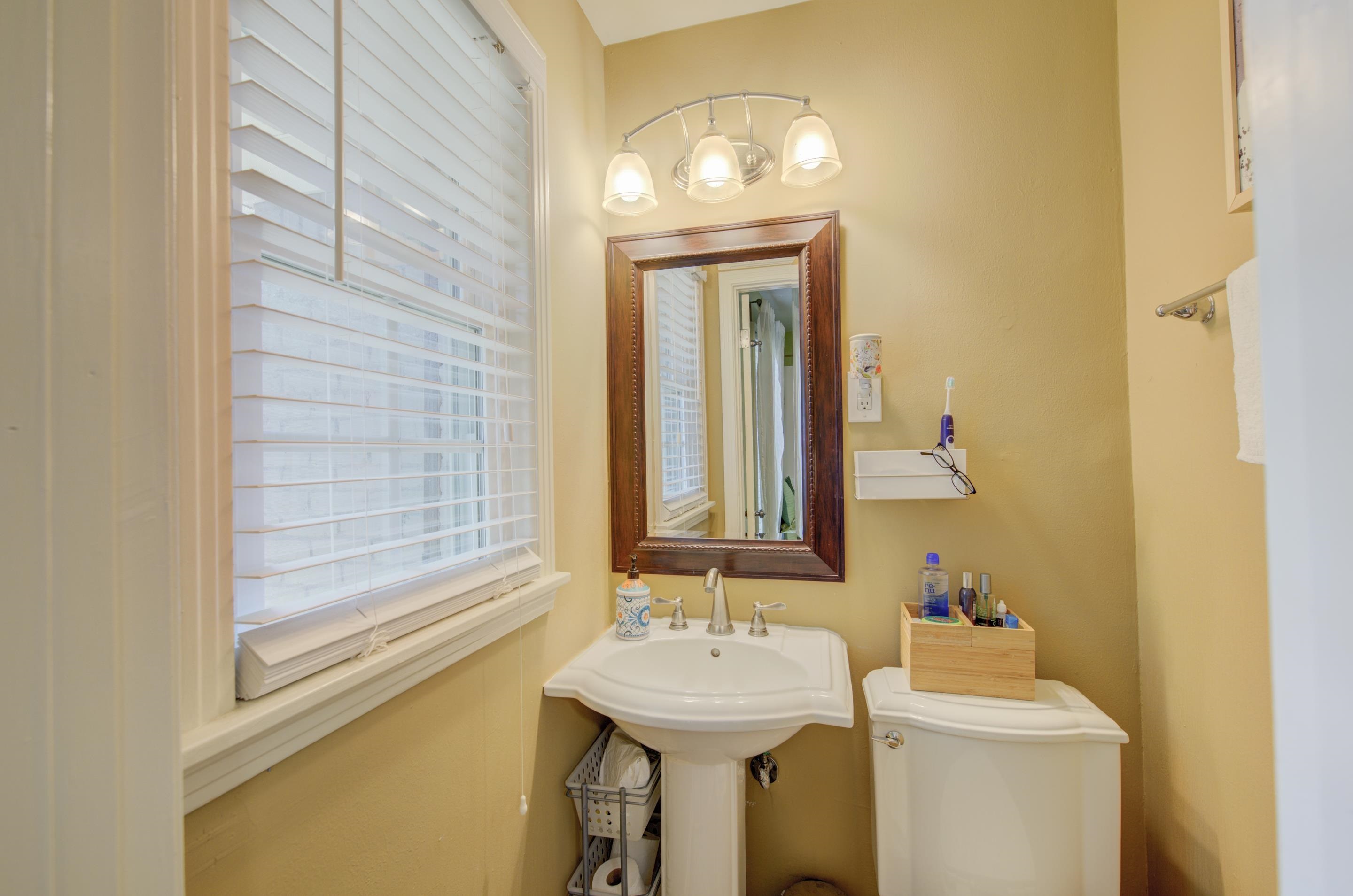 5041 Quince Road Memphis, TN 38117 - Photo 15 of 28 a bathroom with a sink and a mirror