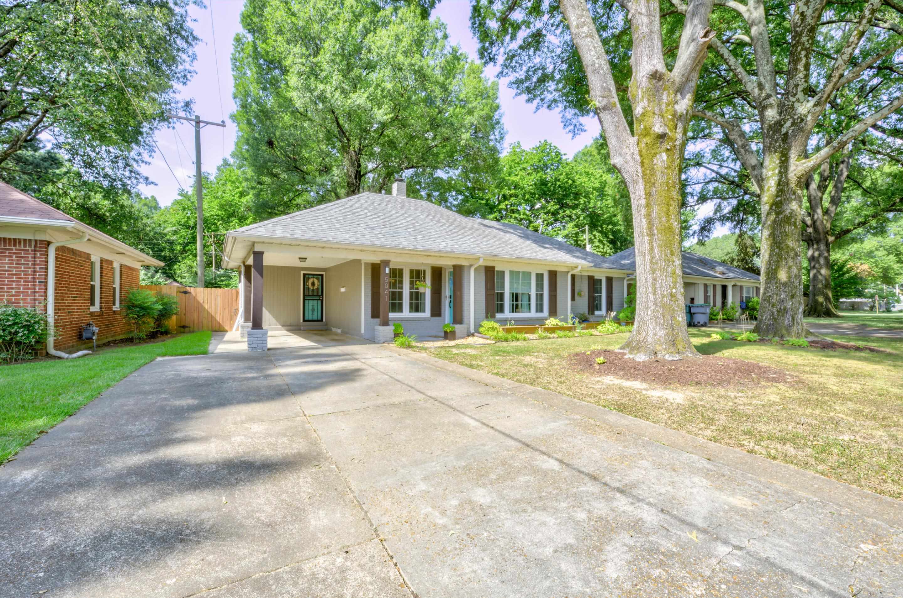 5041 Quince Road Memphis, TN 38117 - Photo 20 of 28 a front view of a house with a yard