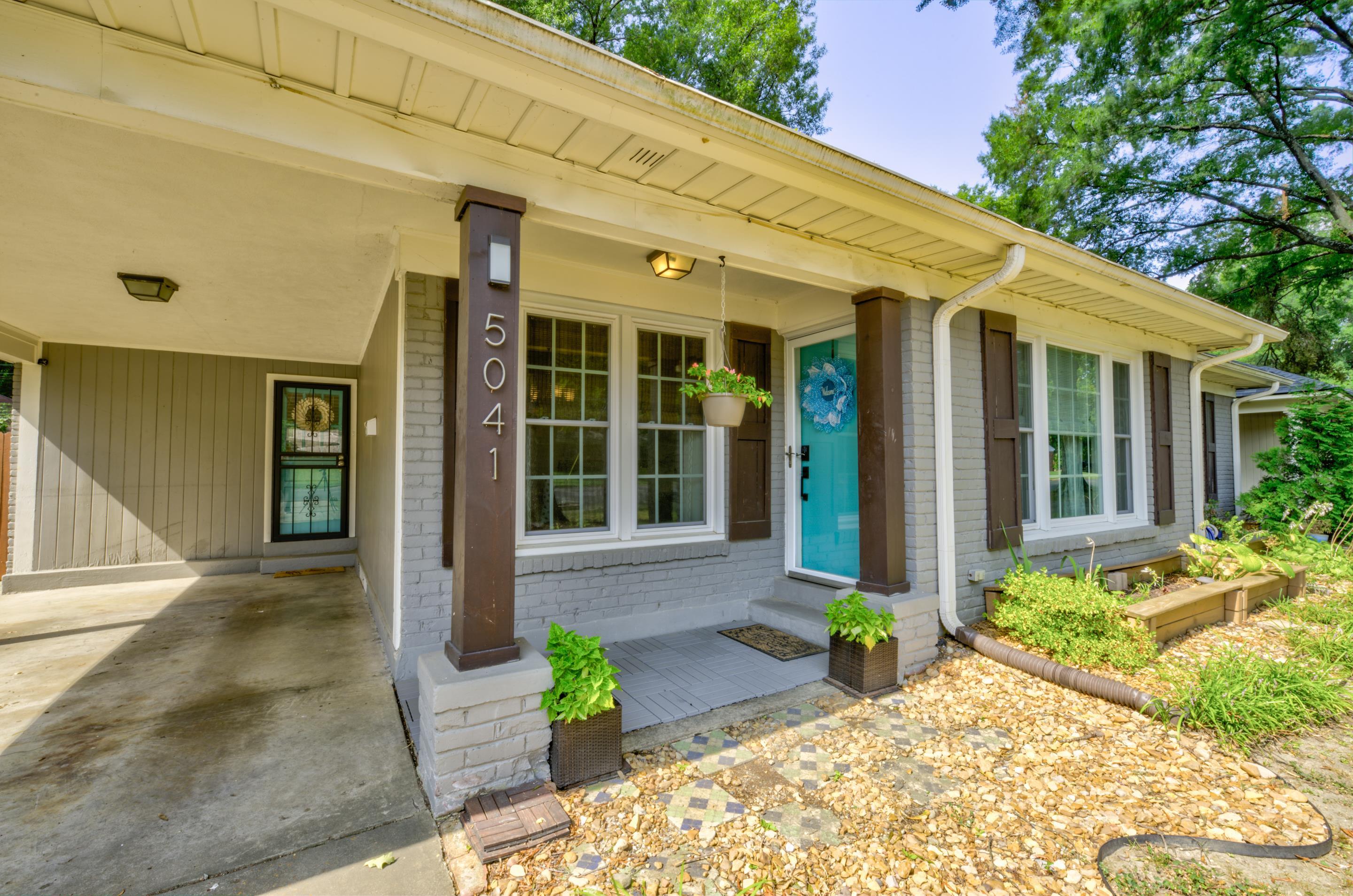 5041 Quince Road Memphis, TN 38117 - Photo 2 of 28 a front view of a house with garden