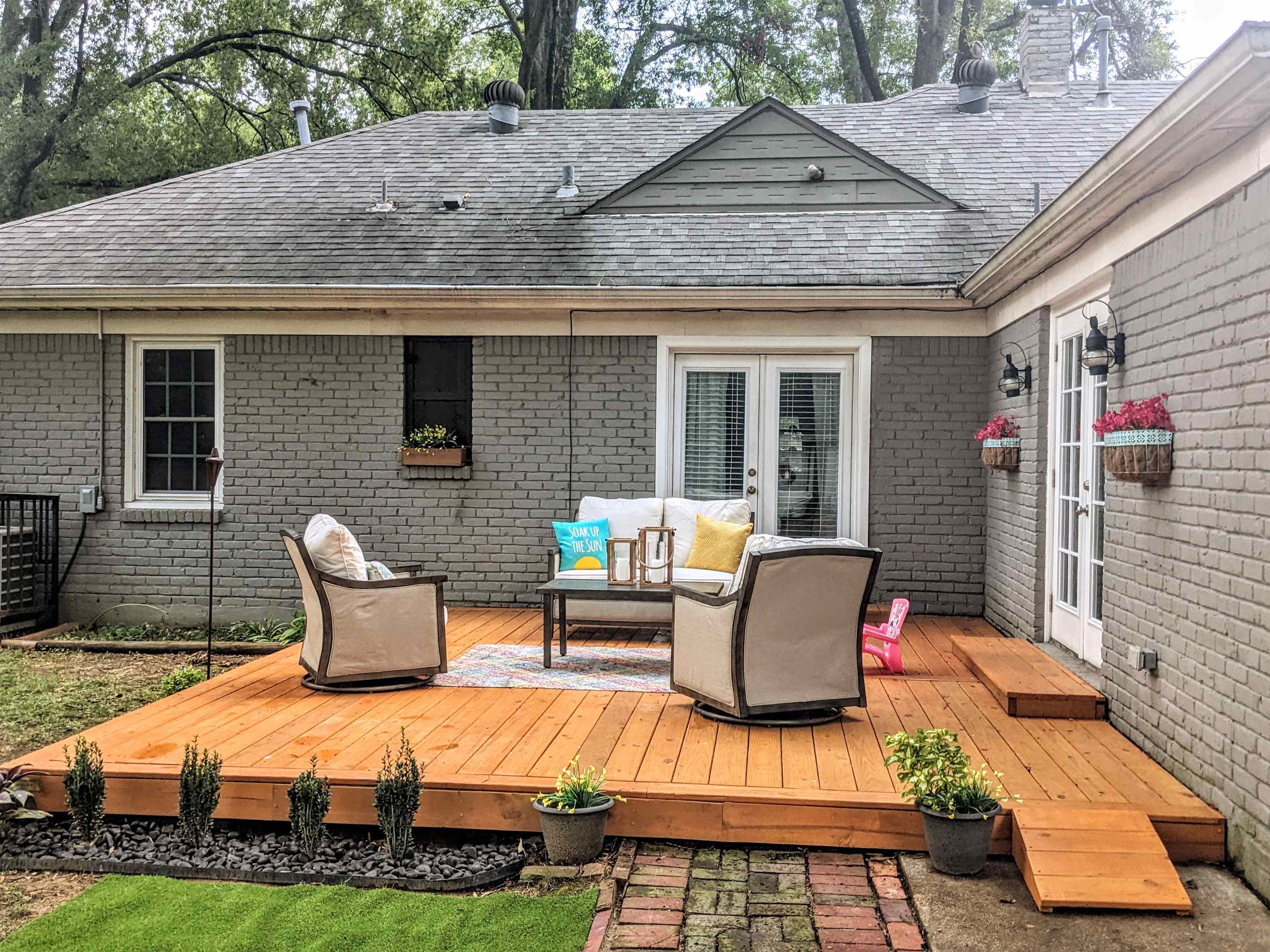 5041 Quince Road Memphis, TN 38117 - Photo 28 of 28 a view of a patio with couches table and chairs with wooden floor and fence