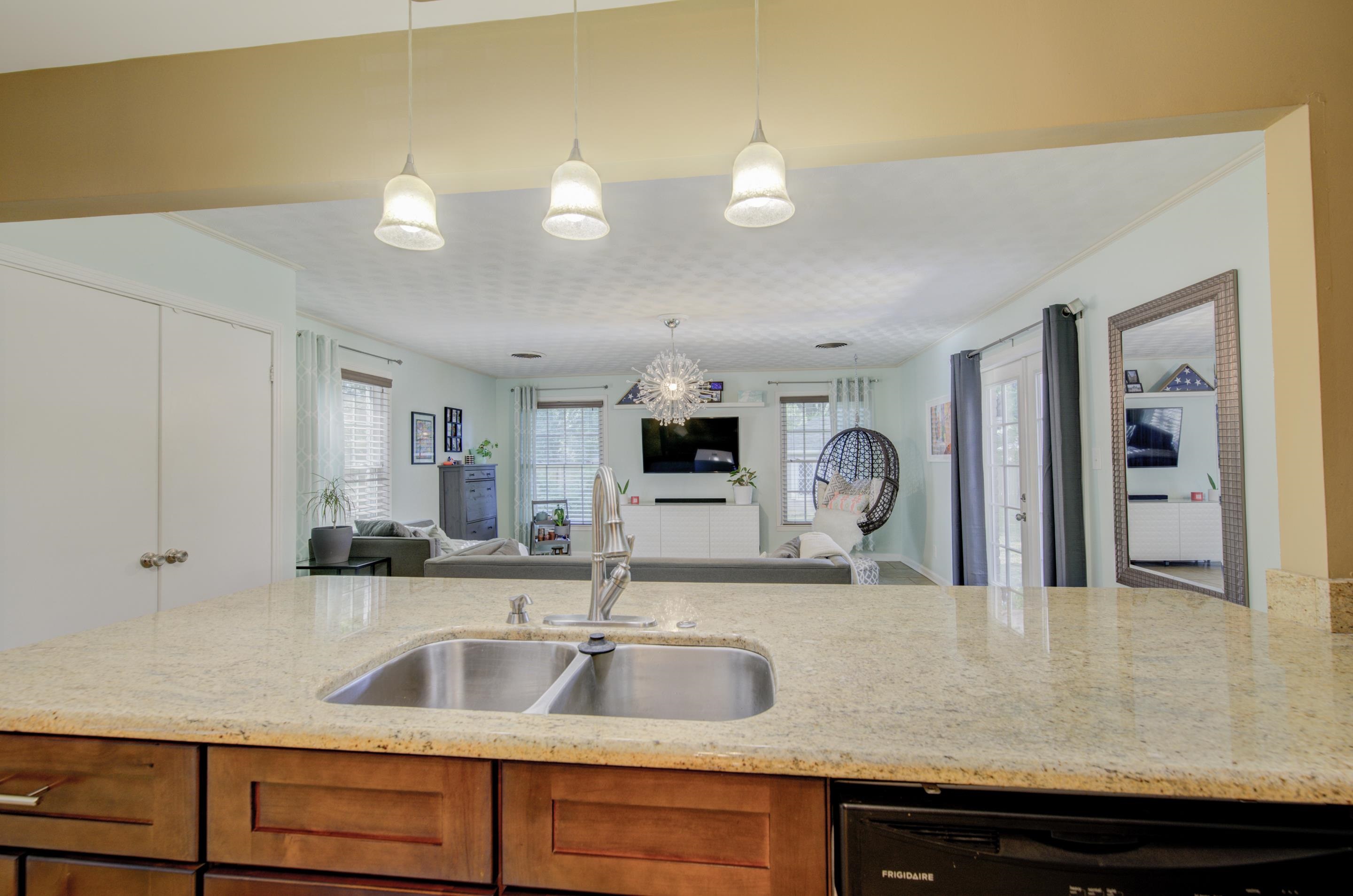 5041 Quince Road Memphis, TN 38117 - Photo 5 of 28 a kitchen with a sink and a refrigerator