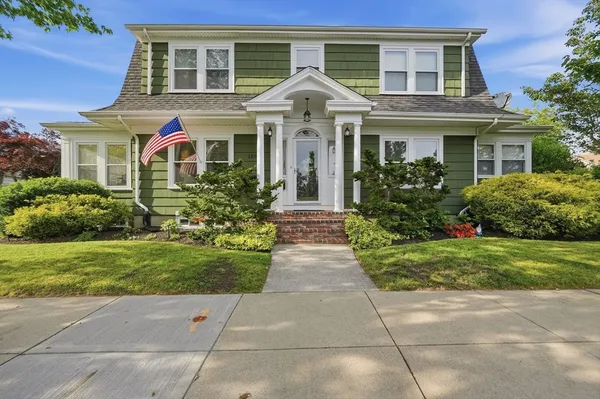 front view of a house with a yard