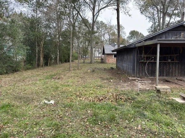a view of outdoor space with trees all around