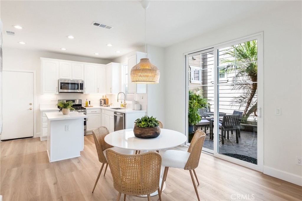 1 Tarleton Lane Ladera Ranch, CA 92694 - Photo 13 of 58 a dining room with furniture window and wooden floor
