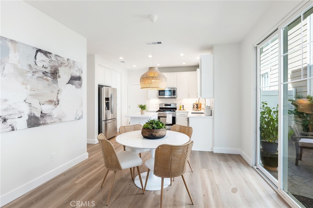 1 Tarleton Lane Ladera Ranch, CA 92694 - Photo 15 of 58 a dining room with furniture and wooden floor