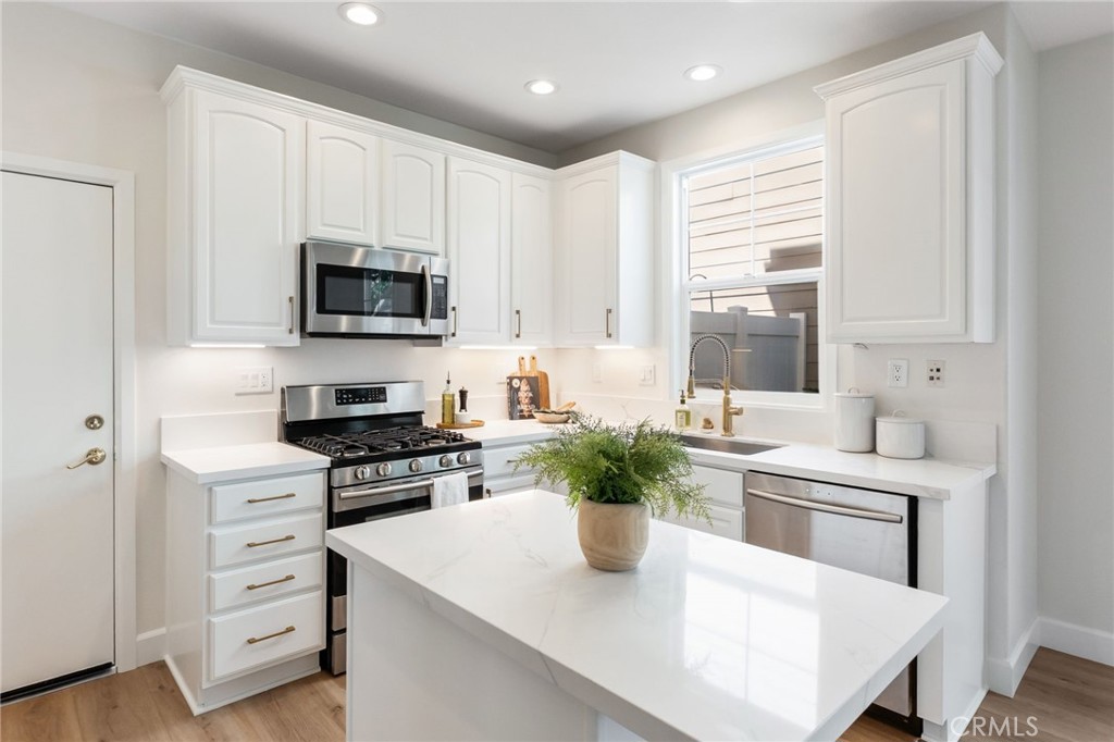 1 Tarleton Lane Ladera Ranch, CA 92694 - Photo 16 of 58 a kitchen with a stove a sink and a refrigerator