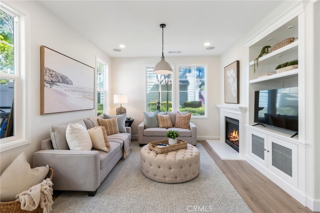 1 Tarleton Lane Ladera Ranch, CA 92694 - Photo 20 of 58 a living room with furniture a flat screen tv and a chandelier