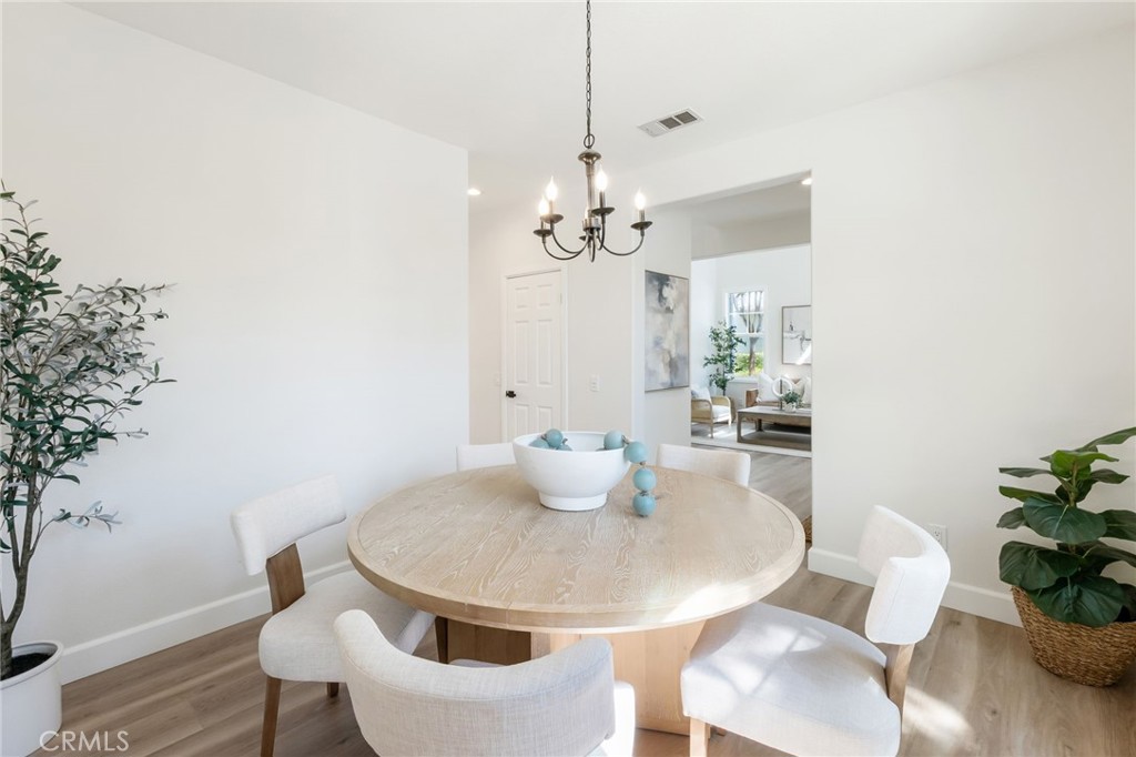 1 Tarleton Lane Ladera Ranch, CA 92694 - Photo 24 of 58 a dining room with furniture and wooden floor