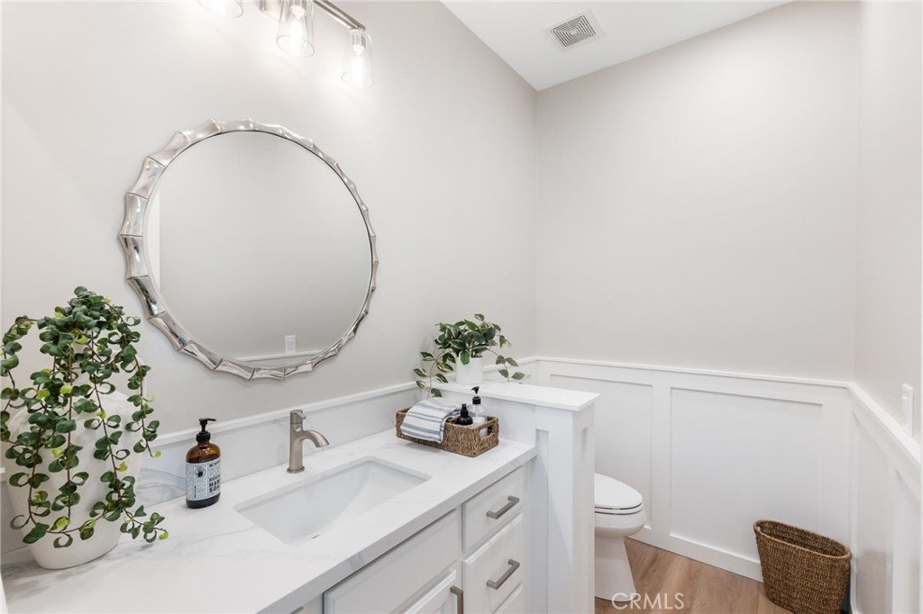 1 Tarleton Lane Ladera Ranch, CA 92694 - Photo 26 of 58 a bathroom with a sink mirror and toilet