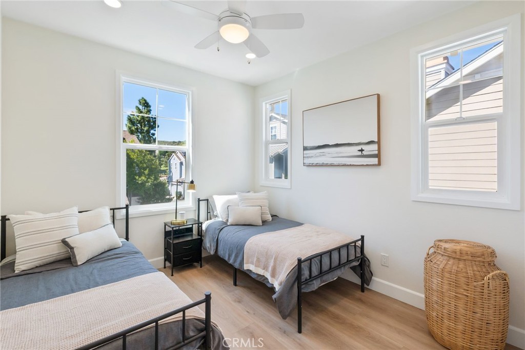 1 Tarleton Lane Ladera Ranch, CA 92694 - Photo 35 of 58 a bedroom with a bed and wooden floor