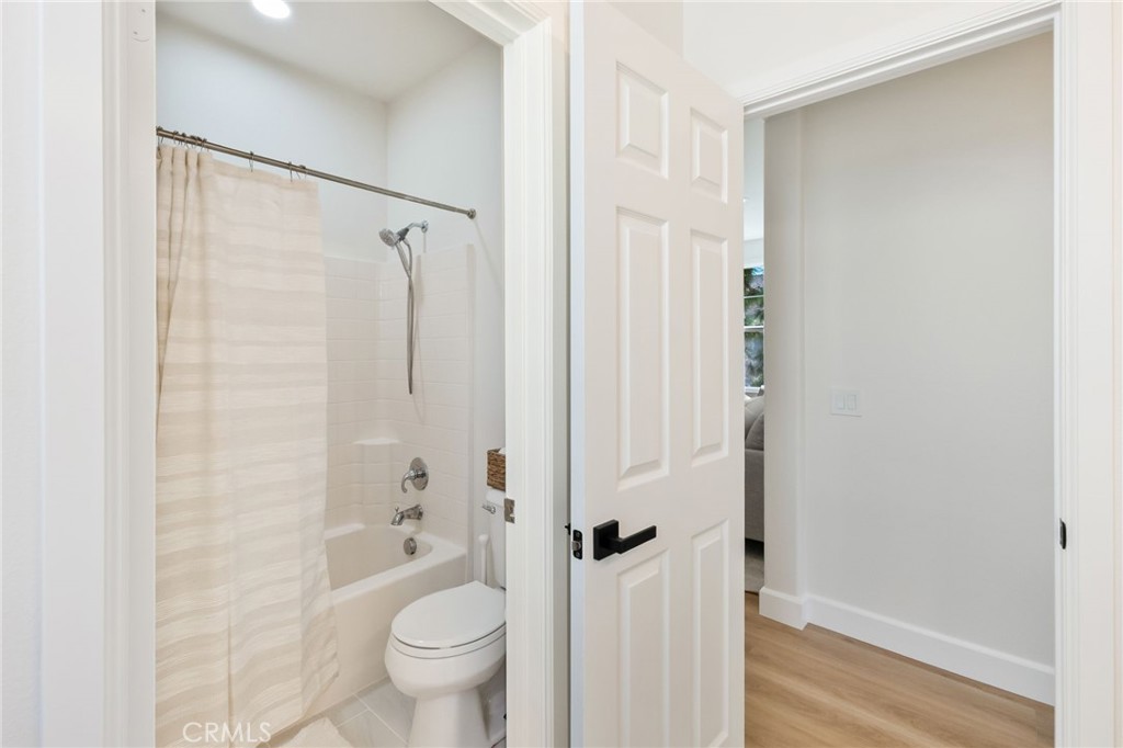 1 Tarleton Lane Ladera Ranch, CA 92694 - Photo 41 of 58 a bathroom with a shower curtain a toilet and a shower