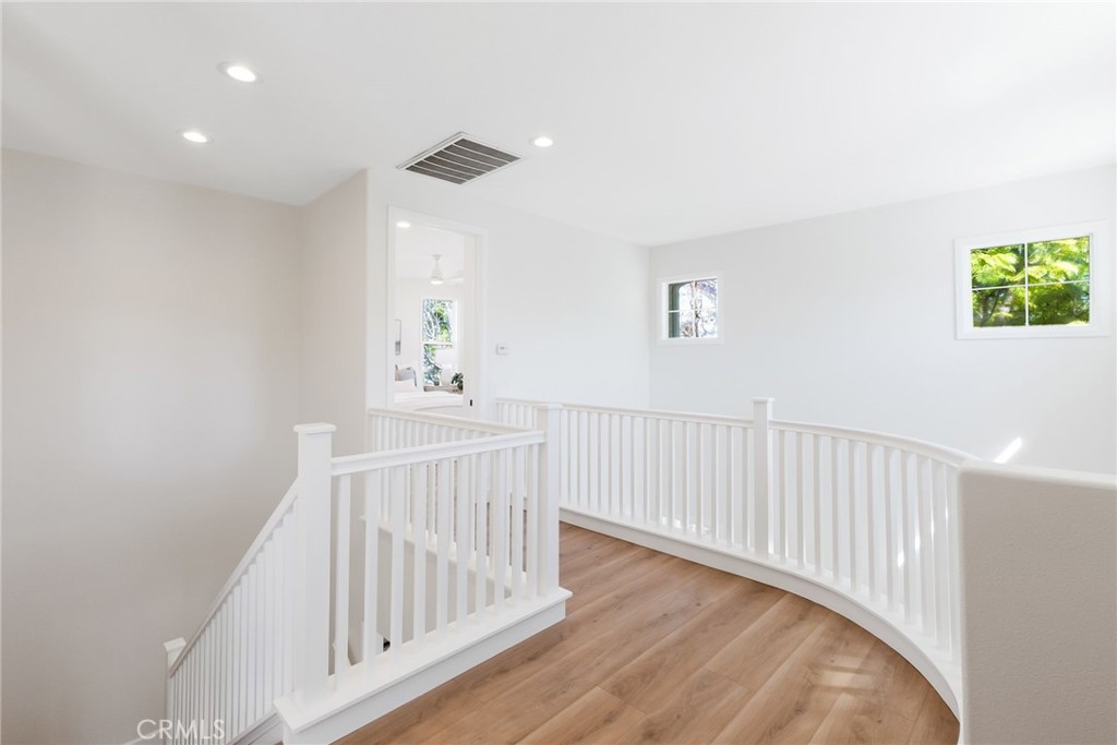 1 Tarleton Lane Ladera Ranch, CA 92694 - Photo 42 of 58 a view of a hallway with wooden floor and windows