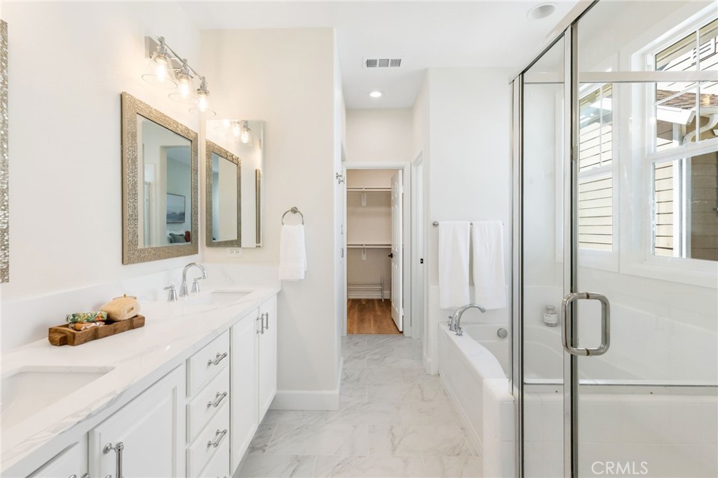 1 Tarleton Lane Ladera Ranch, CA 92694 - Photo 47 of 58 a bathroom with a double vanity sink a mirror and a shower