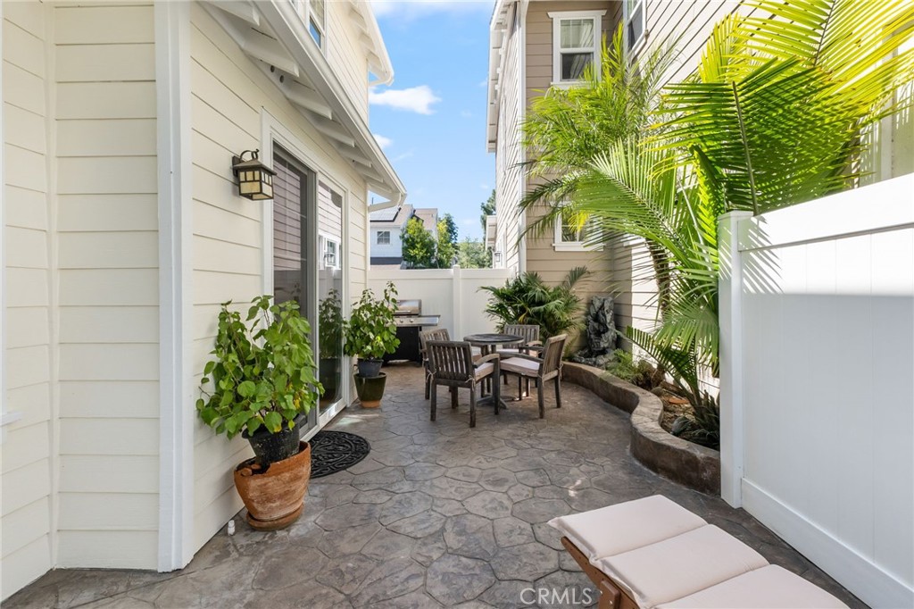 1 Tarleton Lane Ladera Ranch, CA 92694 - Photo 51 of 58 a view of a patio with plants and a table and chair