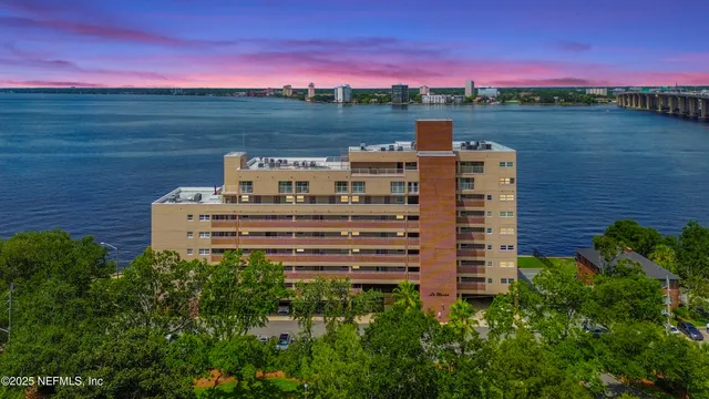 a view of a lake with a building in the background
