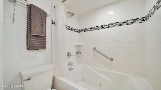 a view of roof deck with chairs and potted plants