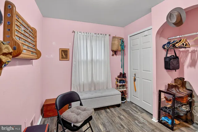 a bedroom with furniture and a window