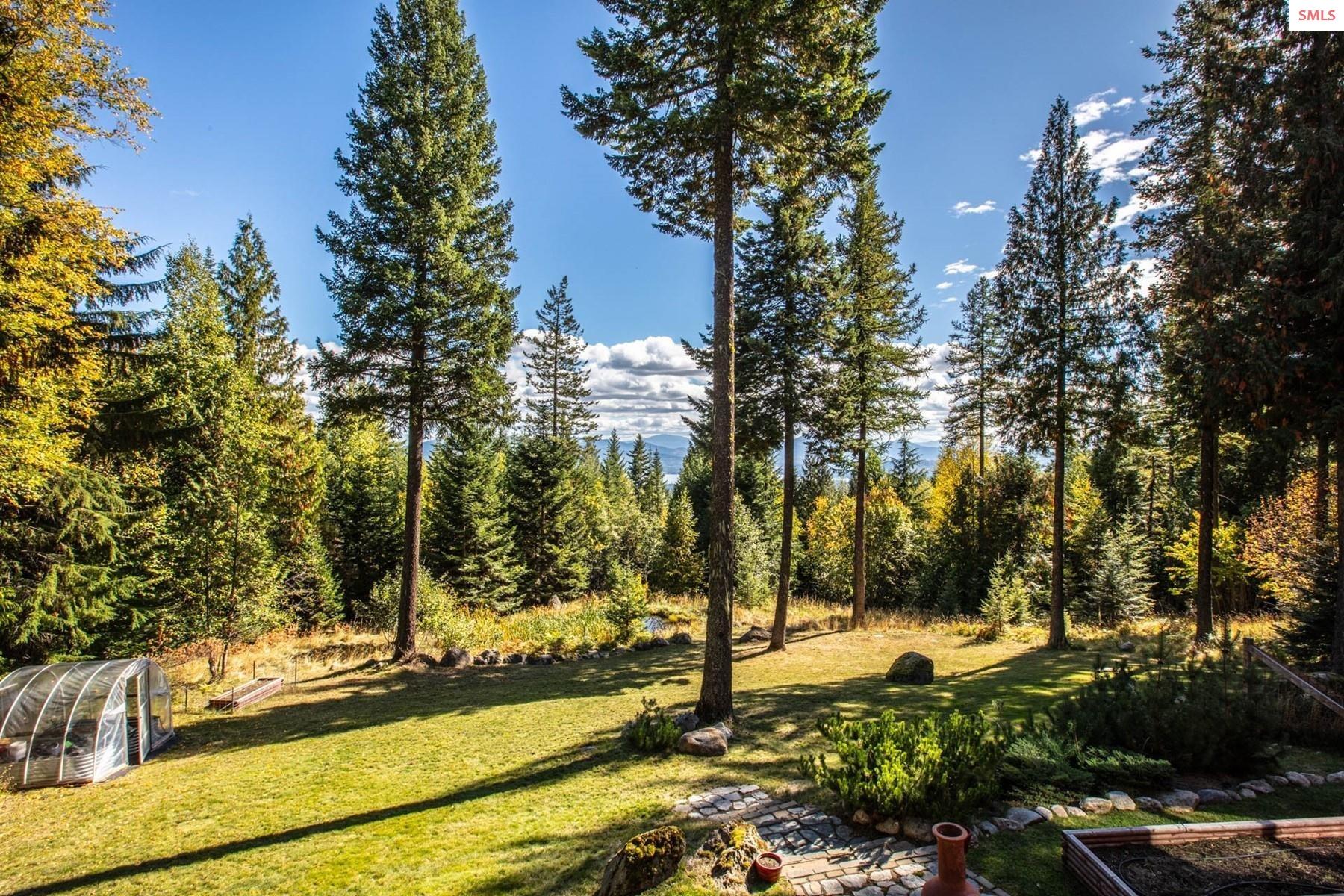 25 Inspiration Way Sandpoint, ID 83864 - Photo 6 of 76 Greenhouse, dog run, gentle sloping yard,
