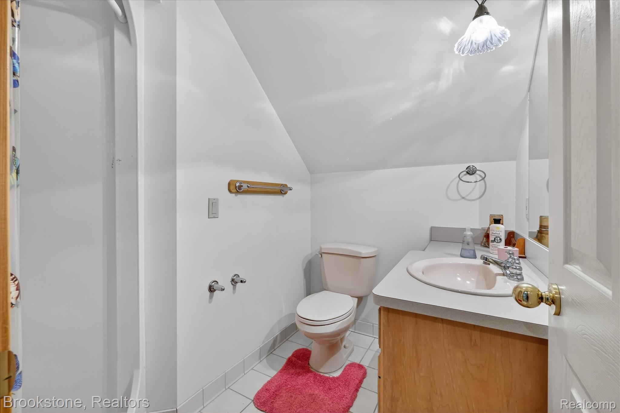5163 Country Squire Road Dryden, MI 48428 - Photo 28 of 64 Bathroom featuring vaulted ceiling, vanity, and light tile patterned floors