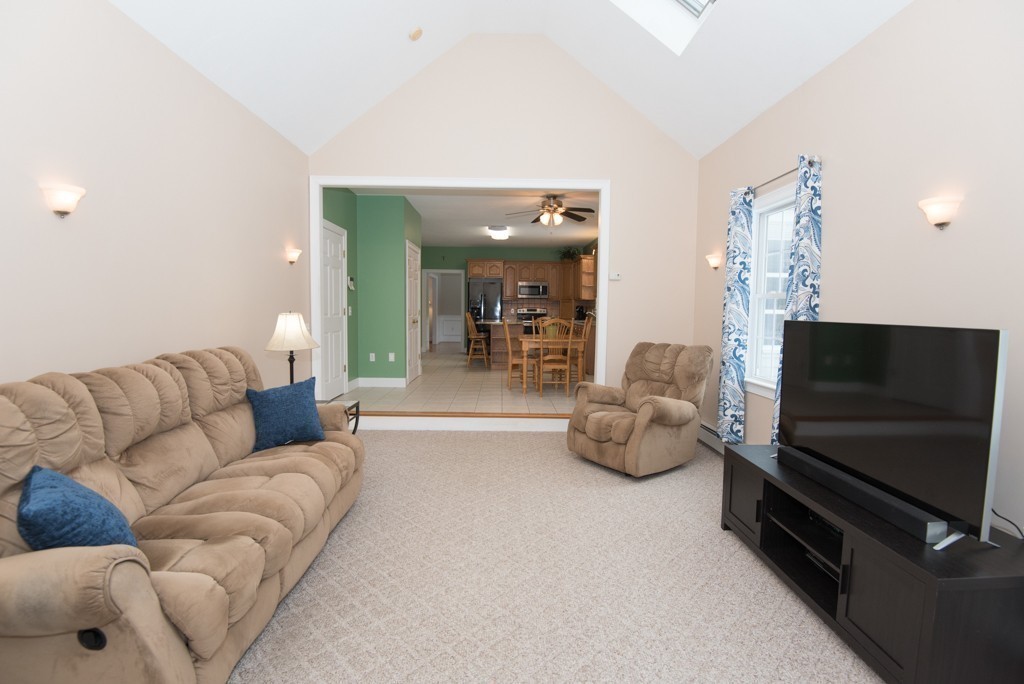 83 Colburn Road Charlton, MA 01507 - Photo 8 of 30 a living room with furniture and a flat screen tv
