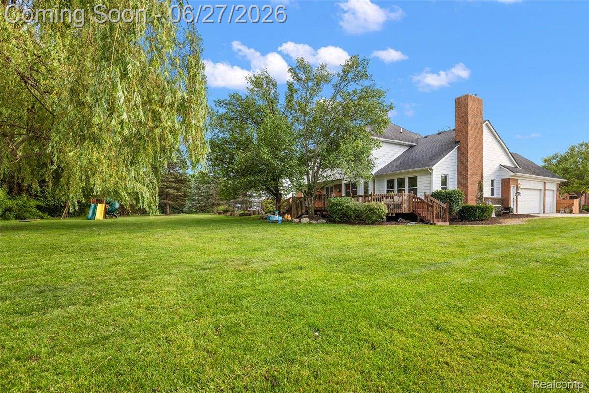 4193 Oak Tree Circle Rochester, MI 48306 - Photo 69 of 72 Expansive green lawn with mature trees