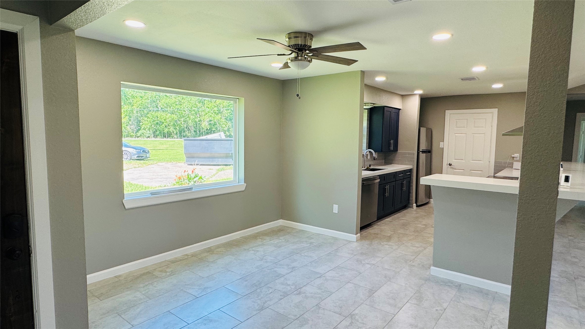 1434 County Road 878A Sweeny, TX 77480 - Photo 15 of 36 a kitchen with stainless steel appliances granite countertop a refrigerator and a sink
