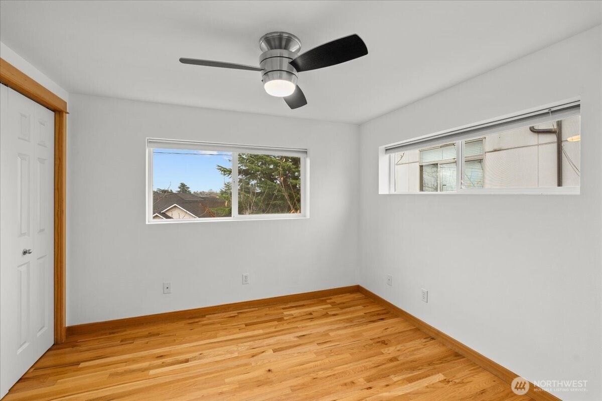 6348 34th Avenue Southwest, Unit C Seattle, WA 98126 - Photo 19 of 26 a view of empty room with wooden floor