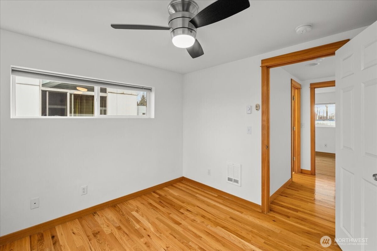 6348 34th Avenue Southwest, Unit C Seattle, WA 98126 - Photo 21 of 26 a view of empty room with wooden floor