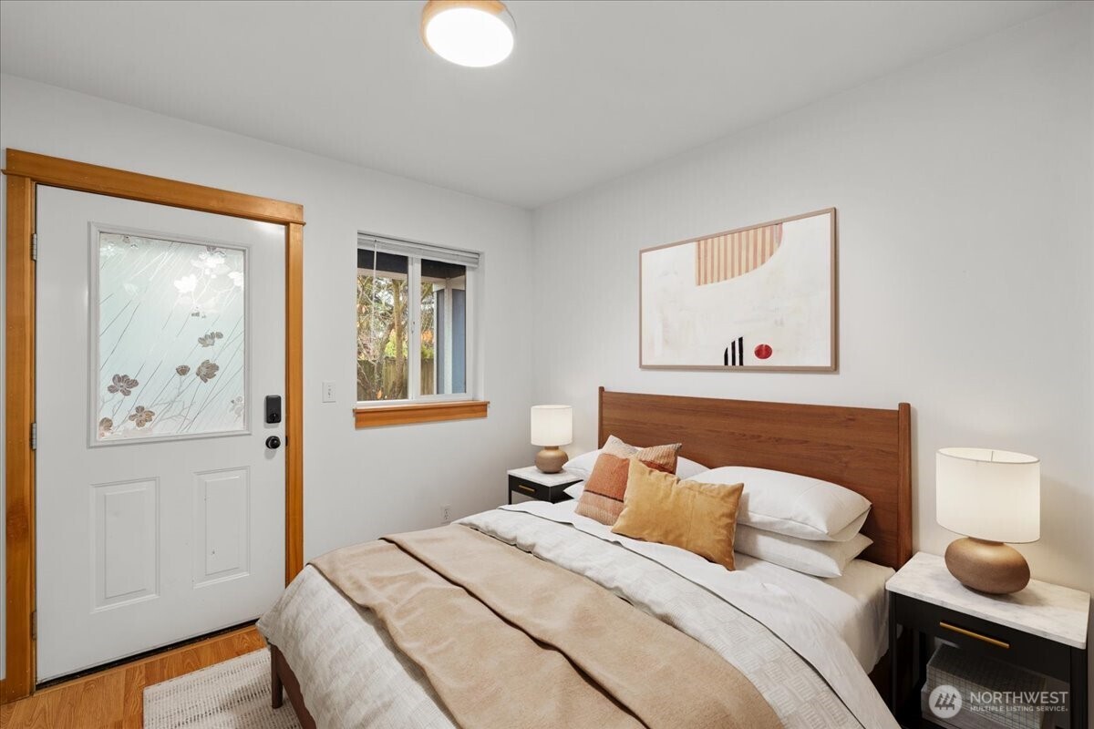 6348 34th Avenue Southwest, Unit C Seattle, WA 98126 - Photo 5 of 26 a bedroom with a bed and a window