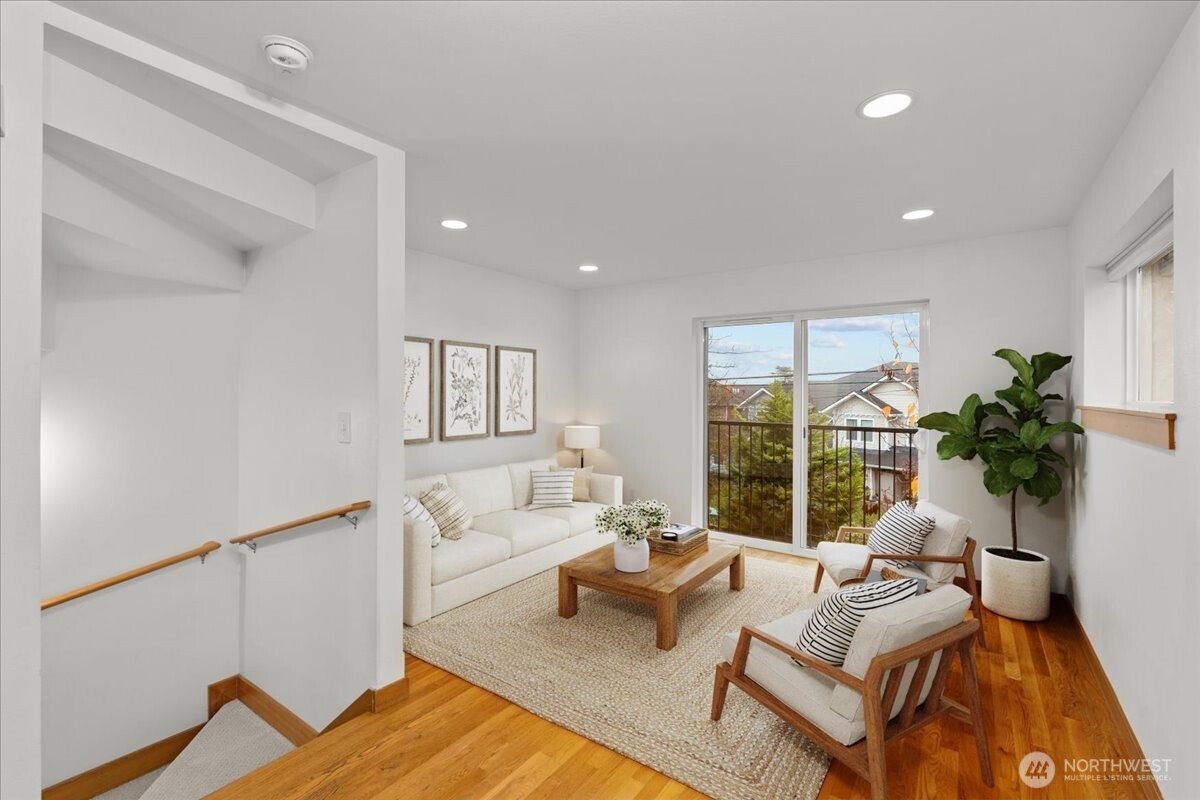 6348 34th Avenue Southwest, Unit C Seattle, WA 98126 - Photo 9 of 26 a living room with furniture and a large window