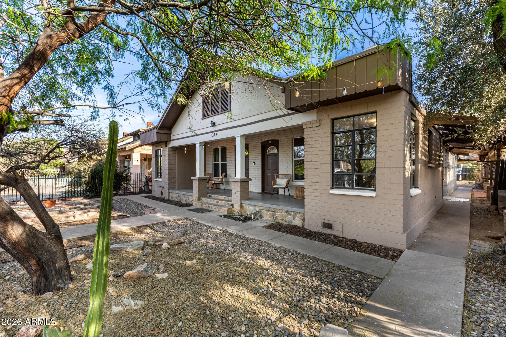 1317 West Monroe Street Phoenix, AZ 85007 - Photo 15 of 86 a front view of a house with garden