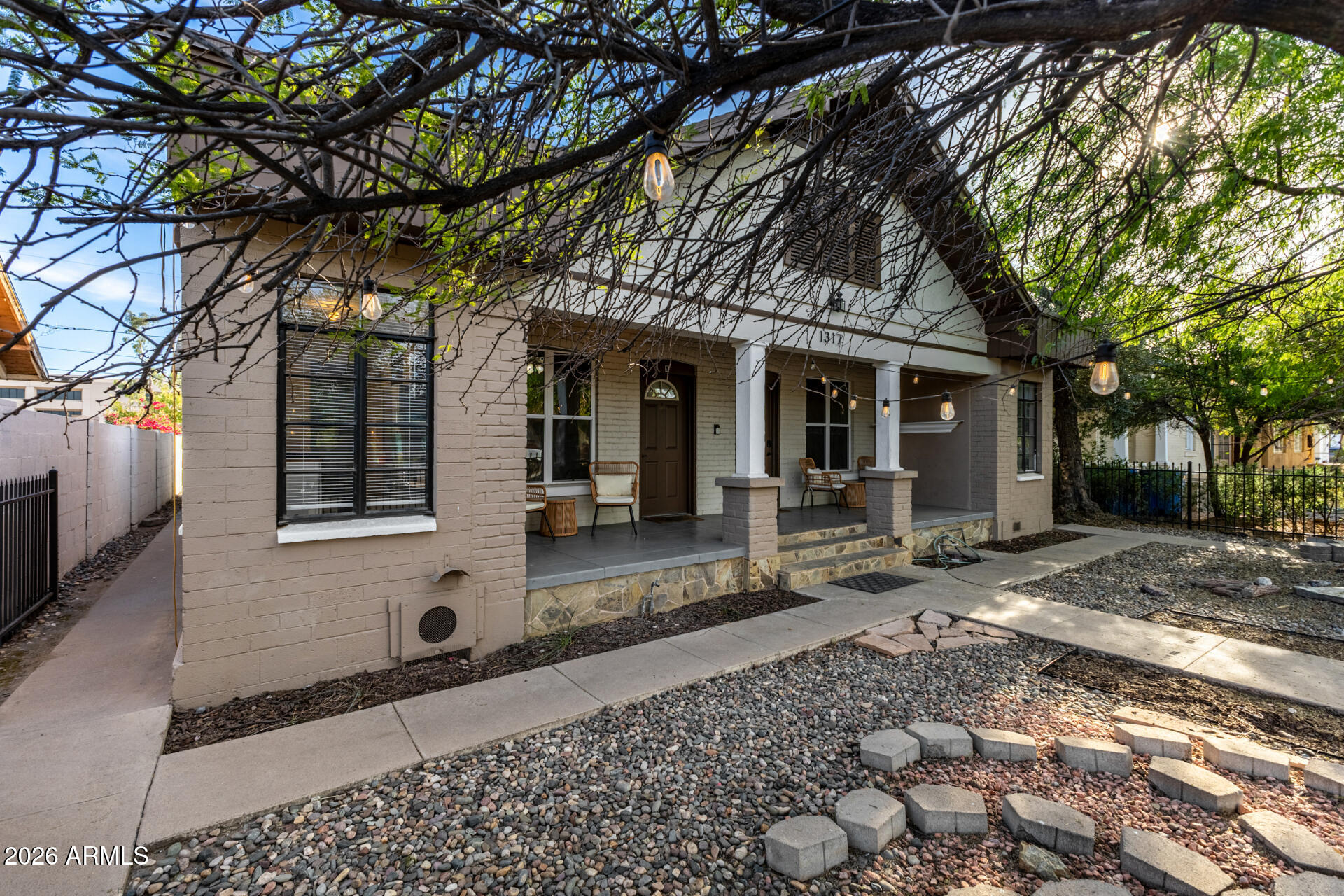 1317 West Monroe Street Phoenix, AZ 85007 - Photo 16 of 86 a front view of a house with a tree