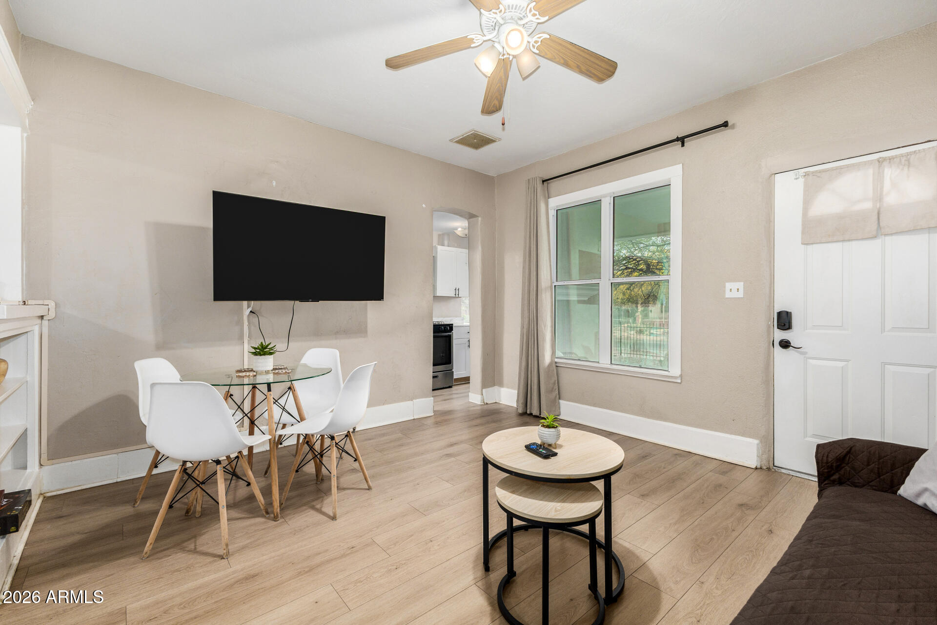1317 West Monroe Street Phoenix, AZ 85007 - Photo 23 of 86 a view of a livingroom with furniture and a flat screen tv
