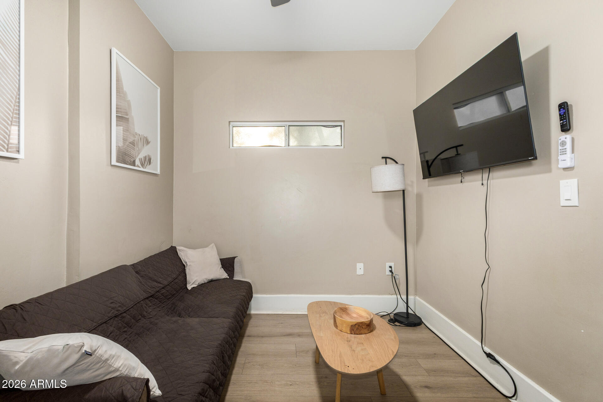 1317 West Monroe Street Phoenix, AZ 85007 - Photo 27 of 86 a living room with furniture and a flat screen tv