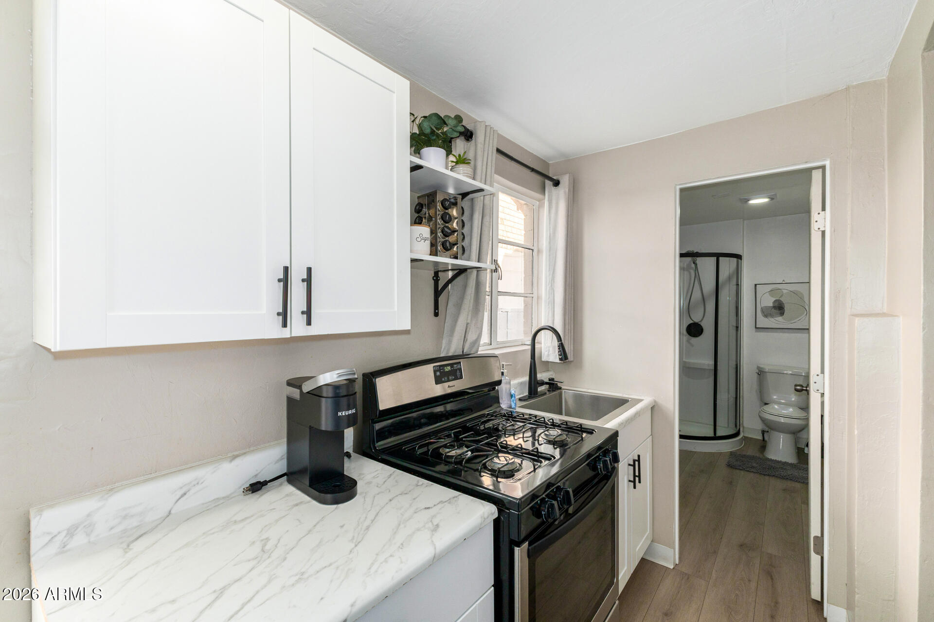 1317 West Monroe Street Phoenix, AZ 85007 - Photo 28 of 86 a kitchen with a stove and a refrigerator