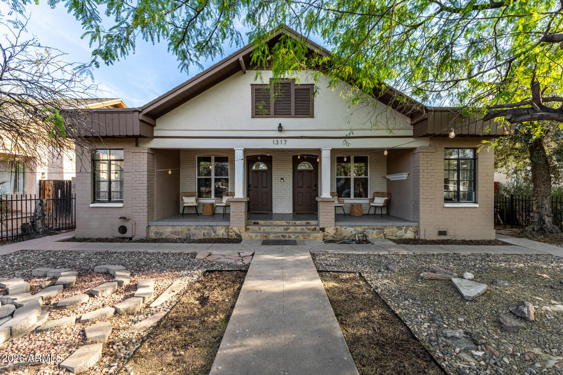 1317 West Monroe Street Phoenix, AZ 85007 - Photo 3 of 86 a front view of a house with garden