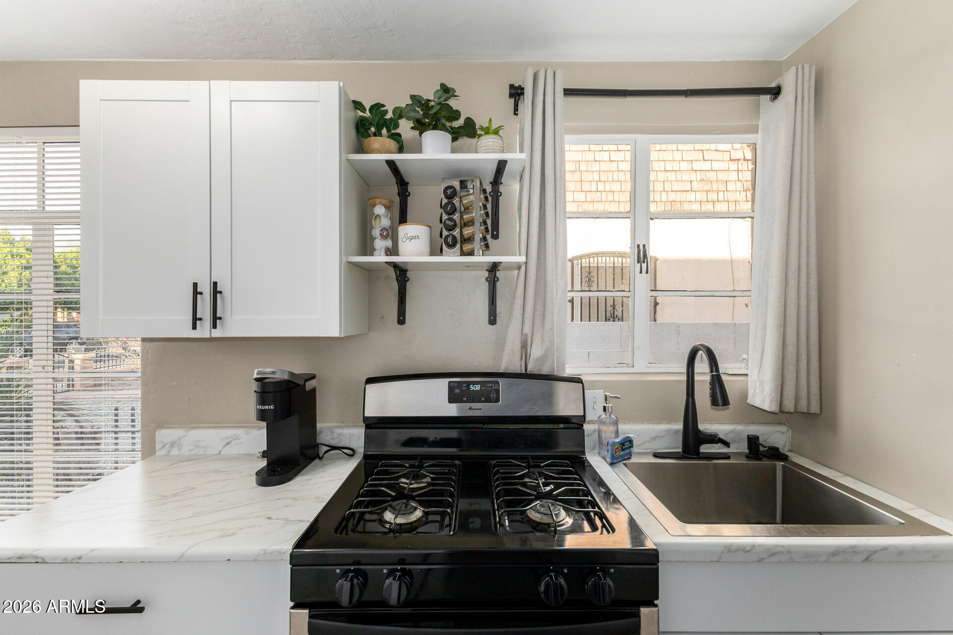 1317 West Monroe Street Phoenix, AZ 85007 - Photo 33 of 86 a kitchen with a stove and a sink