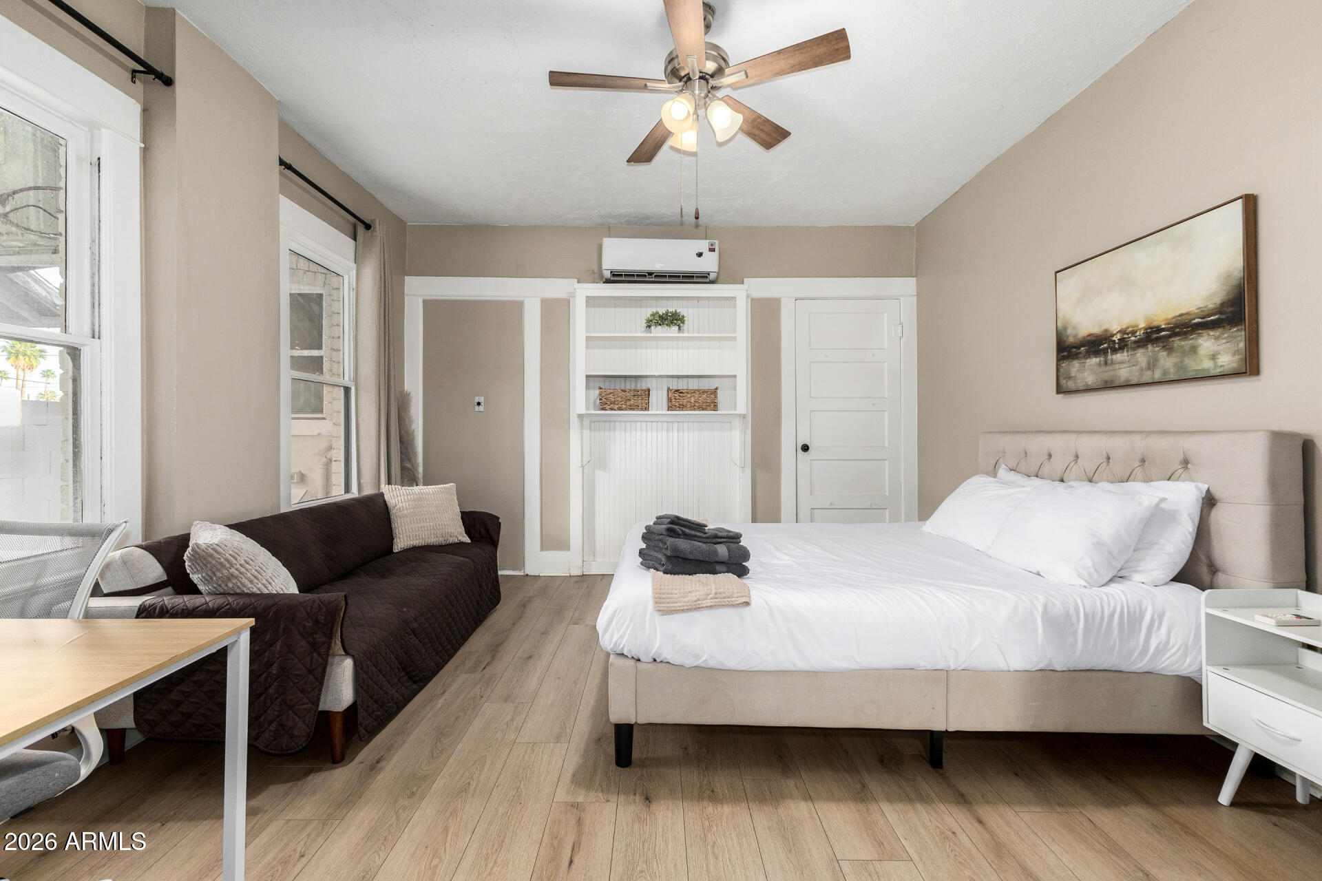 1317 West Monroe Street Phoenix, AZ 85007 - Photo 34 of 86 a bedroom with a bed and wooden floor