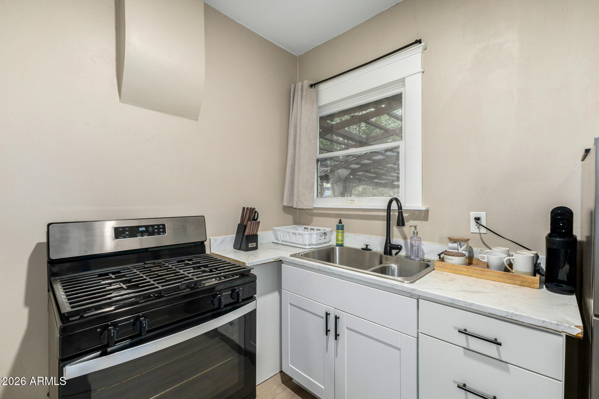 1317 West Monroe Street Phoenix, AZ 85007 - Photo 49 of 86 a kitchen with a sink stove and window