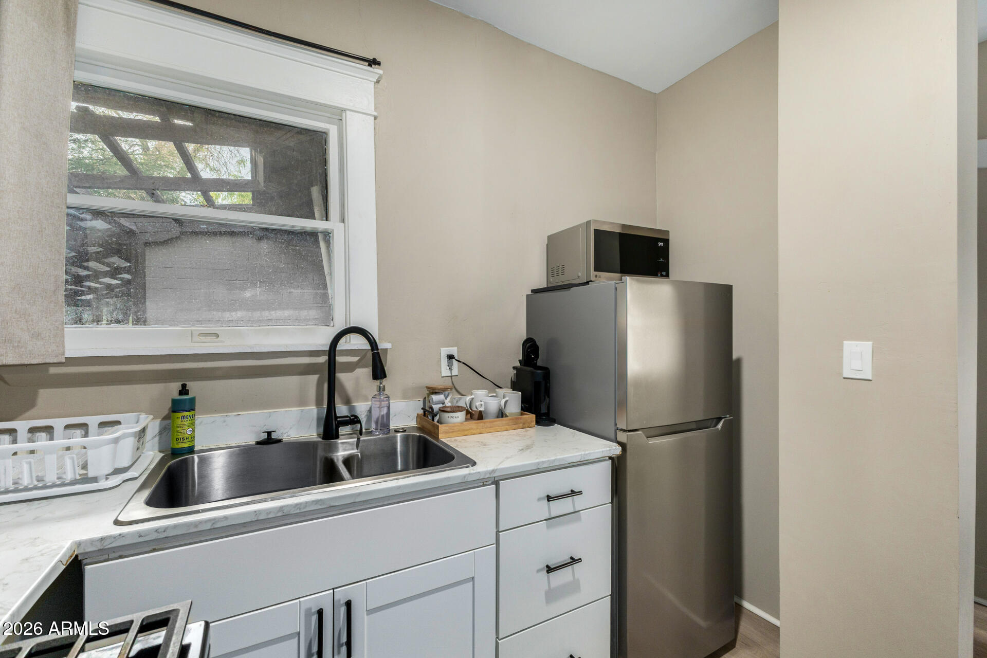 1317 West Monroe Street Phoenix, AZ 85007 - Photo 50 of 86 a kitchen with a refrigerator and a sink