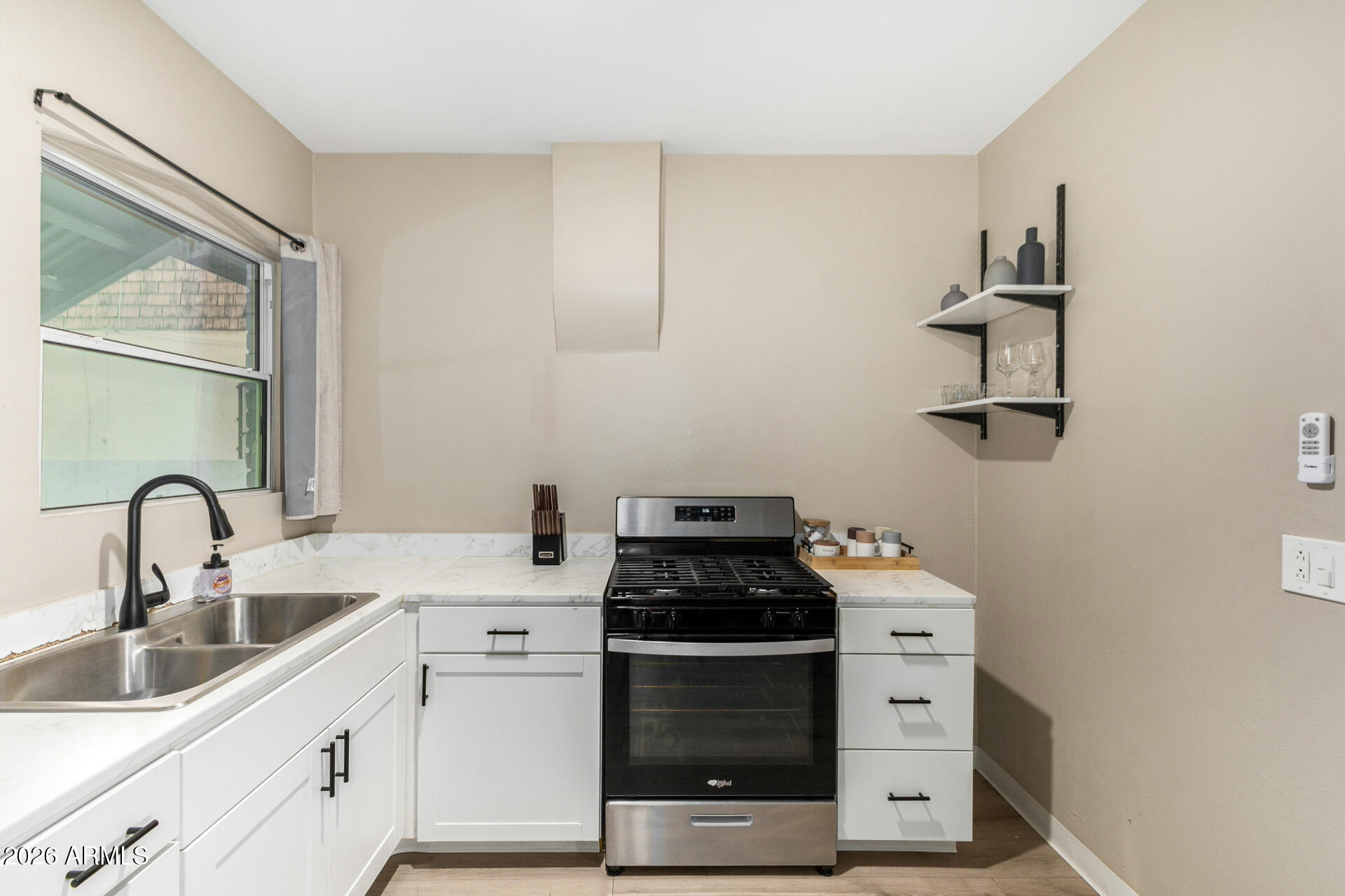 1317 West Monroe Street Phoenix, AZ 85007 - Photo 57 of 86 a kitchen with a stove and a sink