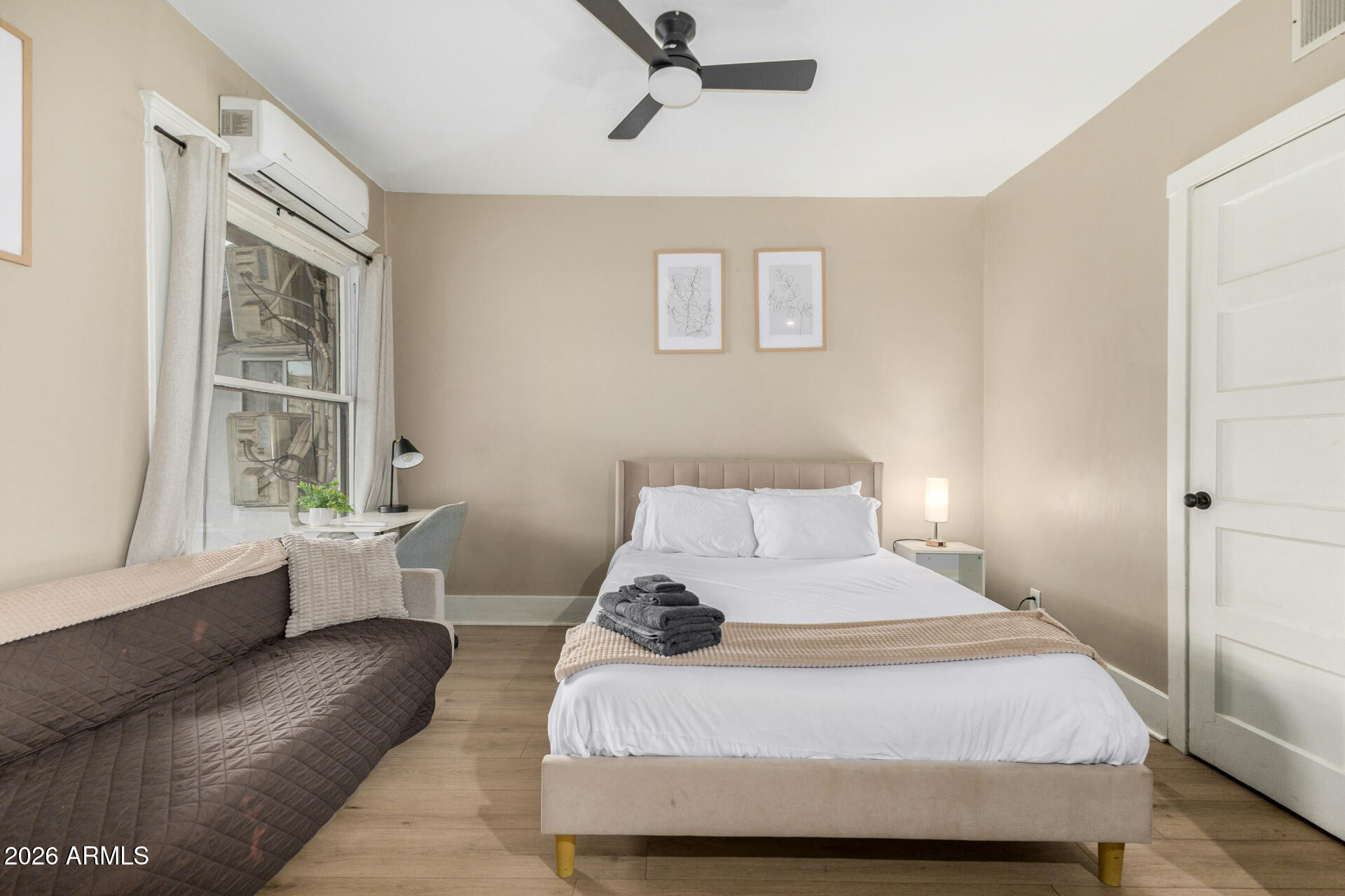 1317 West Monroe Street Phoenix, AZ 85007 - Photo 59 of 86 a bedroom with a large bed and a window