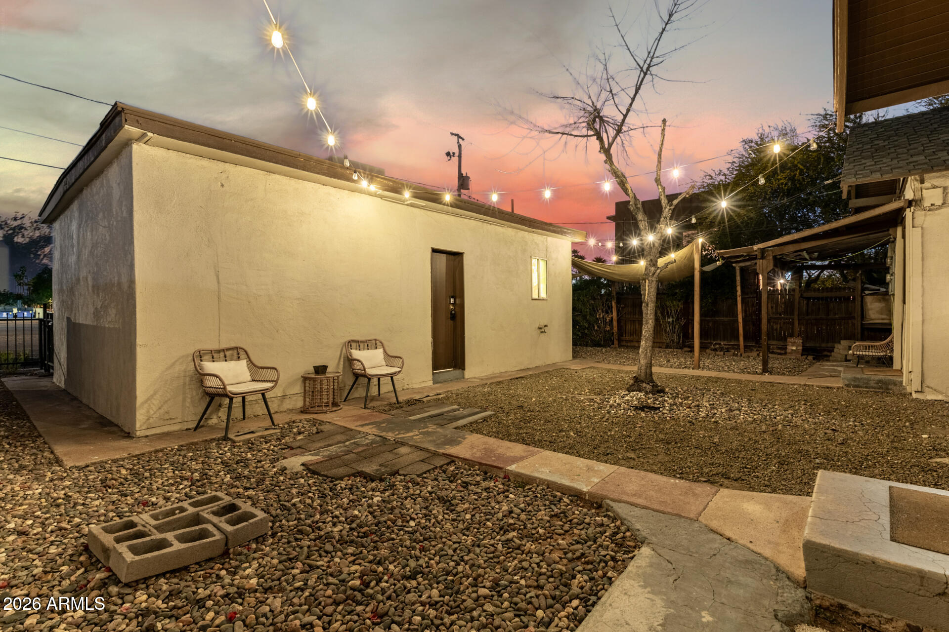 1317 West Monroe Street Phoenix, AZ 85007 - Photo 65 of 86 a view of a porch with a table and chairs