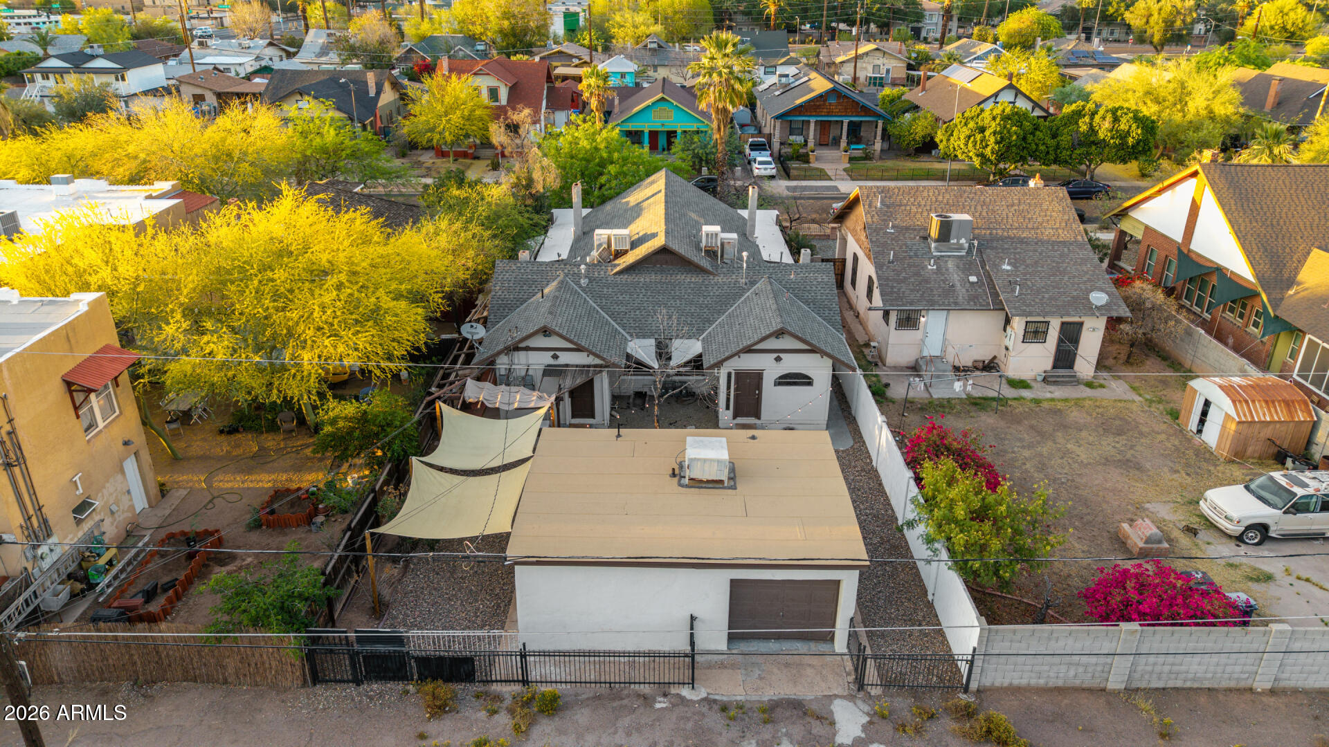 1317 West Monroe Street Phoenix, AZ 85007 - Photo 81 of 86 an aerial view of a house with swimming pool and large trees
